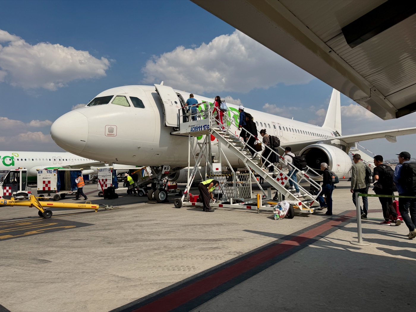 Passengers boarding a Viva Aerobus aircraft at the gate